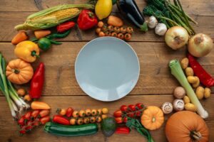 Selection of Keto Low Carb vegetables on Country Kitchen Table.